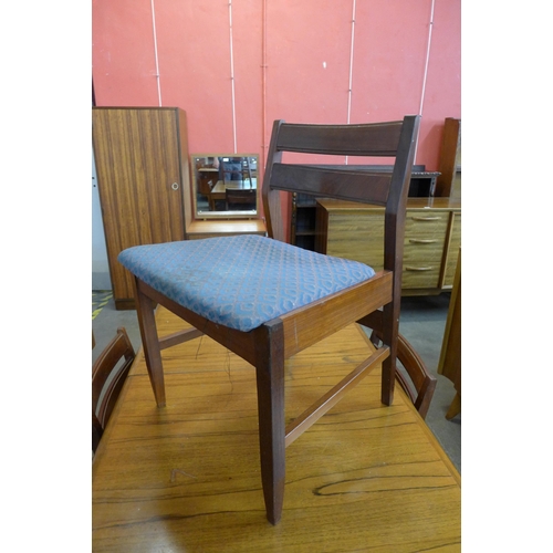 85 - A White & Newton teak extending dining table and four chairs