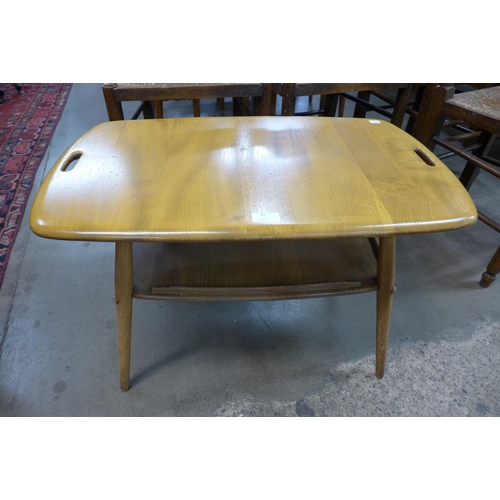 88 - An Ercol Blonde elm and beech two tier tray top table