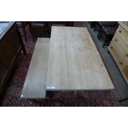 9 - A Victorian style pine x-frame kitchen table with matching bench