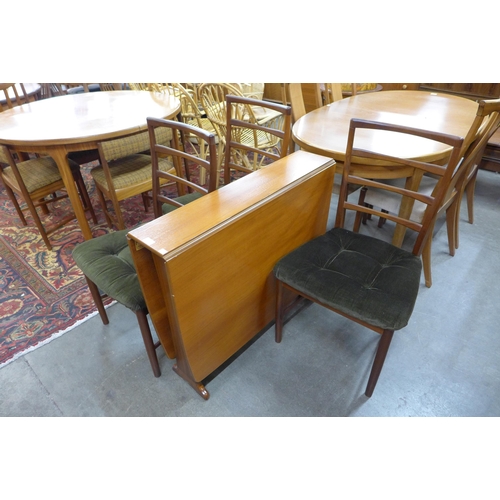 92 - A teak drop leaf table and three chairs