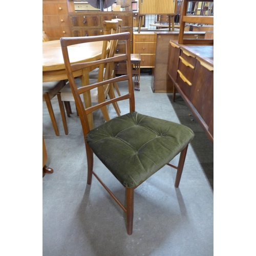 92 - A teak drop leaf table and three chairs