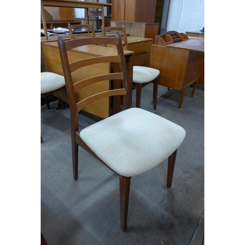 96 - A G-Plan Fresco teak drop leaf table and four chairs