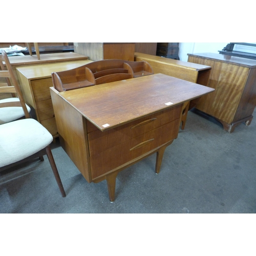 97 - A Jentique teak metamorphic writing desk/chest of drawers