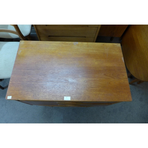 97 - A Jentique teak metamorphic writing desk/chest of drawers