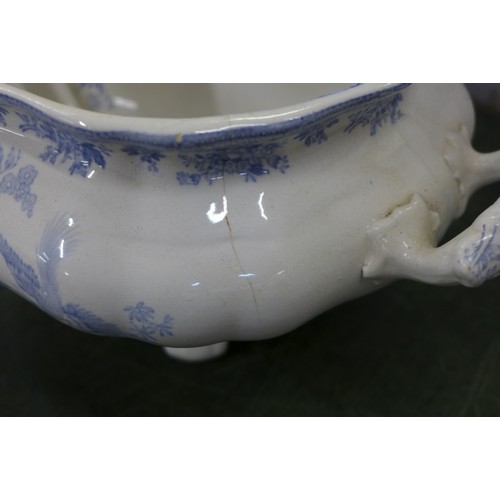 795a - A large tureen with ladle, hairline crack to rim