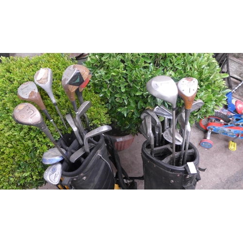 2071 - Two golf bags with approx 25 golf clubs