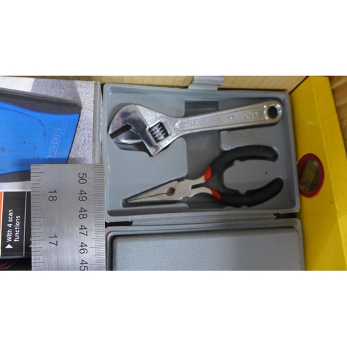 2086 - A box of unused tools, spirit level, set square, ruler, ultra sonic distance meter, multi function d... 