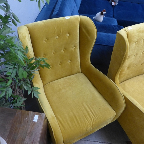 1344 - A mustard yellow button backed armchair