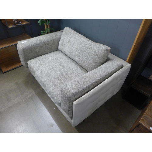 1437 - A grey textured weave and velvet love seat