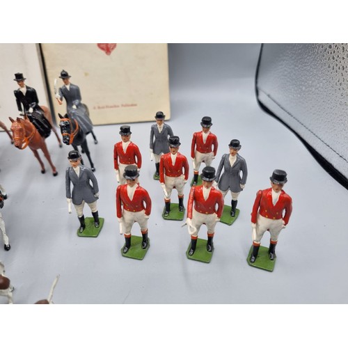 677 - A large collection of Britains lead hunting figures, some similar plastic and diorama accessories