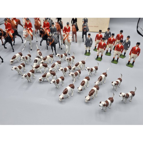 677 - A large collection of Britains lead hunting figures, some similar plastic and diorama accessories