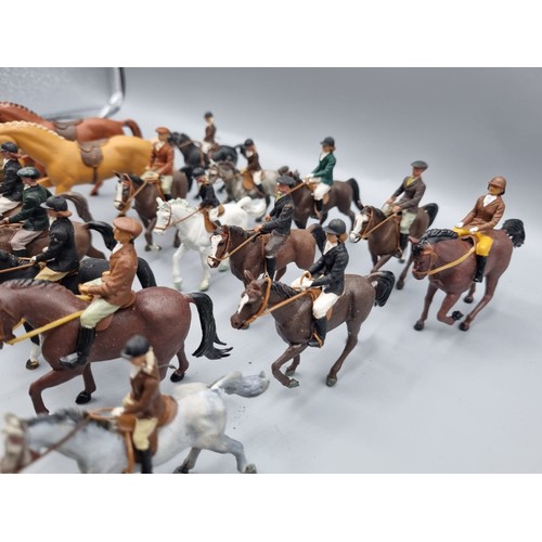 677 - A large collection of Britains lead hunting figures, some similar plastic and diorama accessories