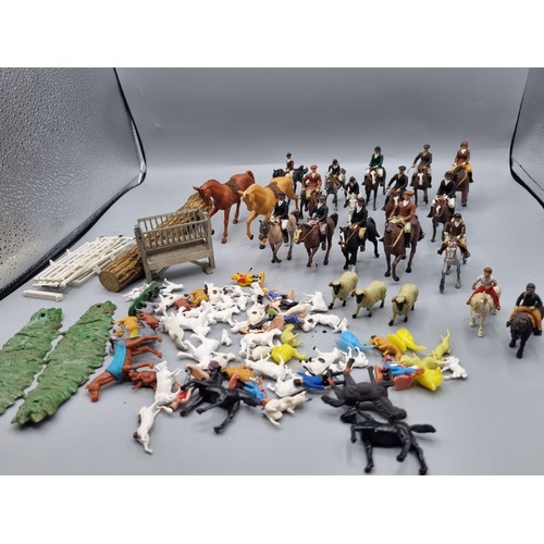 677 - A large collection of Britains lead hunting figures, some similar plastic and diorama accessories