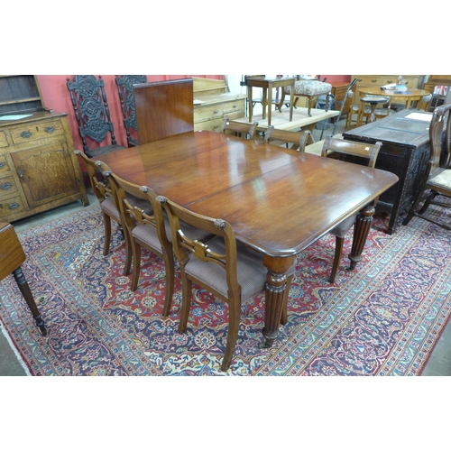 85 - A Victorian mahogany extending dining table and six Regency style chairs, table dimensions; 72cms h,... 