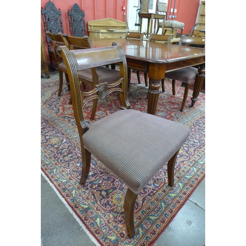 85 - A Victorian mahogany extending dining table and six Regency style chairs, table dimensions; 72cms h,... 