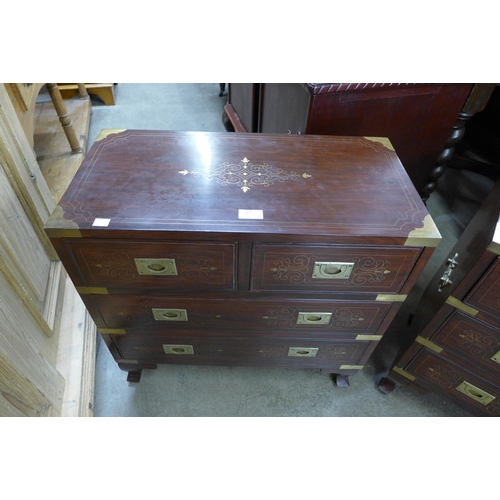 140 - A pair of small eastern hardwood and brass inlaid campaign style chests of drawers