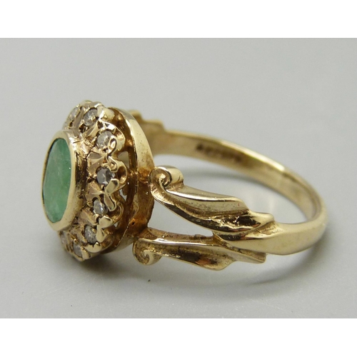 1005 - A 9ct gold, emerald and diamond cluster ring, 3.4g, M