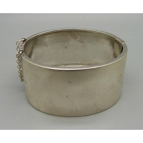 1021 - A sterling silver bangle, 41g