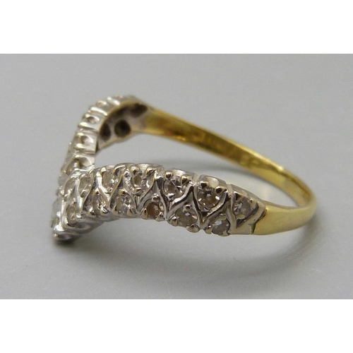 1033 - An 18ct gold and diamond wishbone ring, 3.4g, R, mark worn