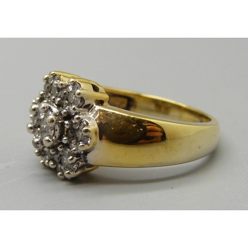 1048 - A yellow metal and diamond multi-cluster ring, marked 18K, 8.9g, R