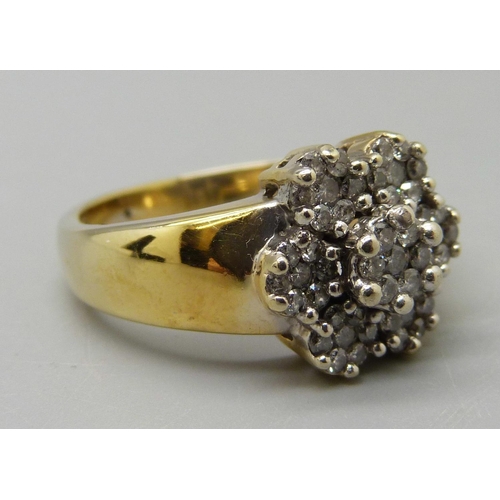 1048 - A yellow metal and diamond multi-cluster ring, marked 18K, 8.9g, R