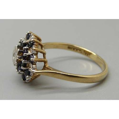 1054 - A 9ct gold, diamond and sapphire cluster ring, maker BMJ, 3.4g, Q/R