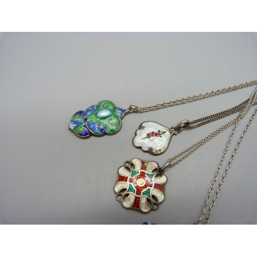 1072 - Four silver and enamel pendants, (two with red enamel a/f)