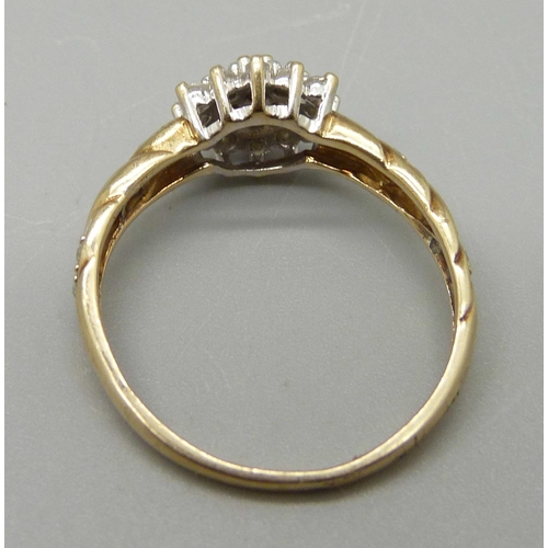 1082 - A 9ct gold and diamond ring, 2g, N