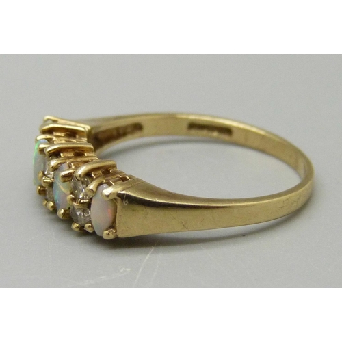 1086 - A 9ct gold, opal and CZ ring, 1.9g, N