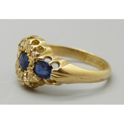 1091 - An 18ct gold, sapphire and diamond cluster ring, Birmingham 1906, 3.5g, N