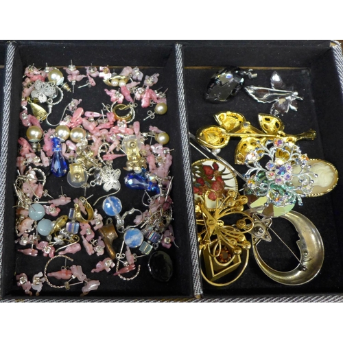 670 - A collection of costume jewellery including some silver in a jewellery box