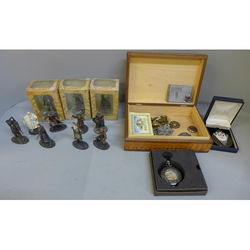 673 - A pocket watch, a stamp case, military buttons etc., and a collection of Lord of the Rings figures, ... 