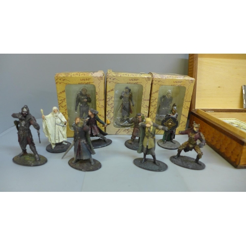 673 - A pocket watch, a stamp case, military buttons etc., and a collection of Lord of the Rings figures, ... 