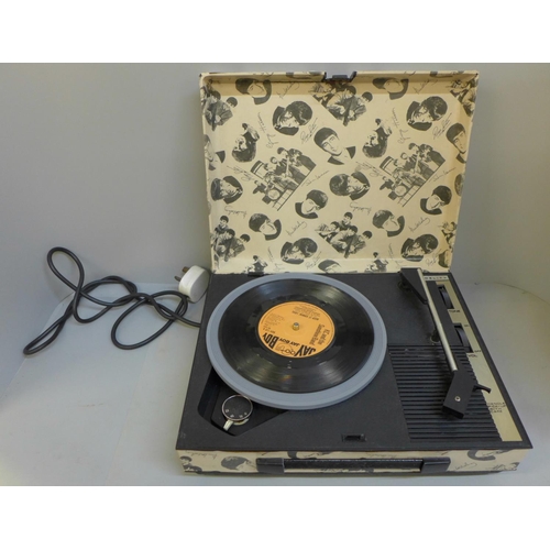 691 - A vintage record player with applied Beatles cover