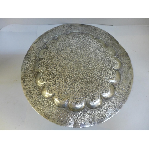 702 - A metal plaque/charger, 36.5cm