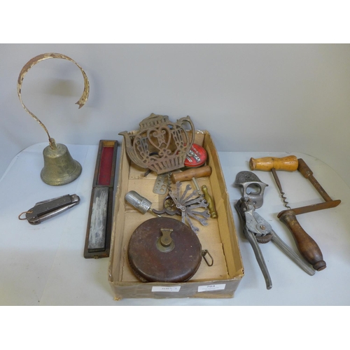 703 - Assorted items, a bell, tape measure, Marstons bottle opener, pocket knife, etc.