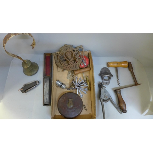 703 - Assorted items, a bell, tape measure, Marstons bottle opener, pocket knife, etc.