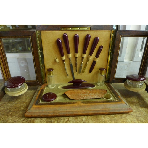 775 - A Victorian manicure case/cabinet with contents (lacking scissors), with bevelled glass panels and m... 