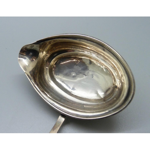 820 - A Georgian silver ladle with baleen handle, worn London hallmark