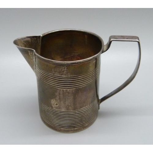 827 - A George III silver jug, London 1811, with initials, 82g