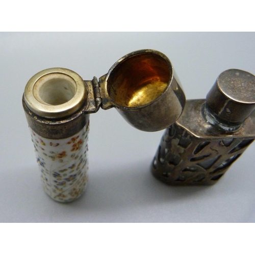 835 - A porcelain scent bottle with a white metal top, (top dented) and another silver and glass perfume b... 