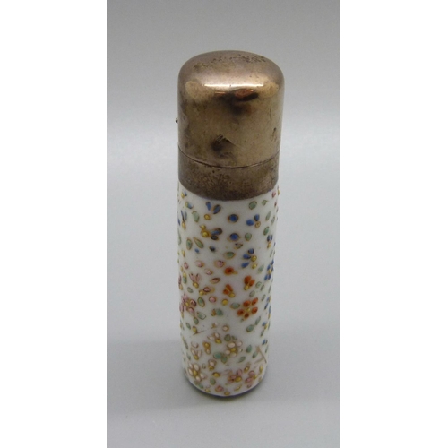 835 - A porcelain scent bottle with a white metal top, (top dented) and another silver and glass perfume b... 