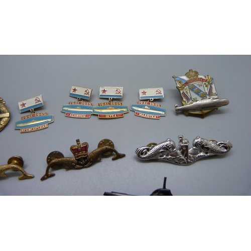 848 - A collection of Russian badges including tin submarines