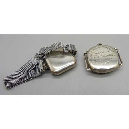 945 - Two silver wristwatches, one case back bears inscription dated 1960