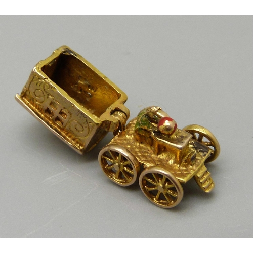 979 - A 9ct gold Romany fortune teller's caravan charm, bottom opens to reveal fortune teller with a cryst... 