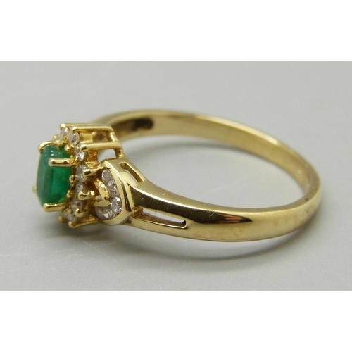 989 - A yellow metal, emerald and diamond ring, marked 18K, 3.2g, O