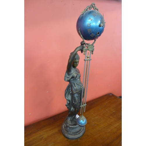 112 - A French Art Nouveau style bronze and enamelled figural swinger mystery table clock