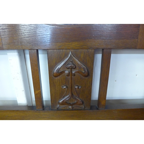 120 - An Art Nouveau carved oak mirrored hall stand