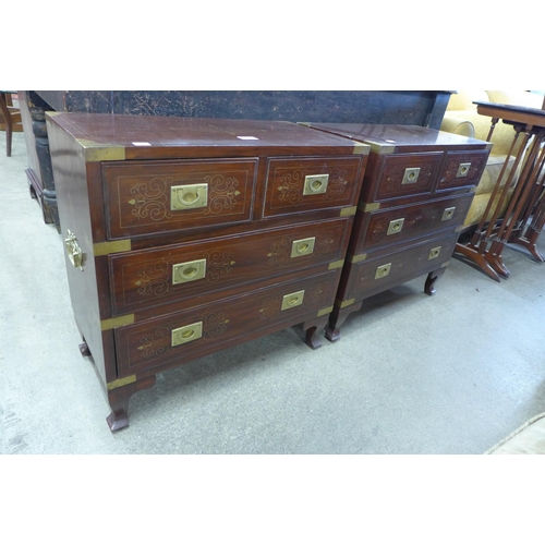 140 - A pair of small eastern hardwood and brass inlaid campaign style chests of drawers