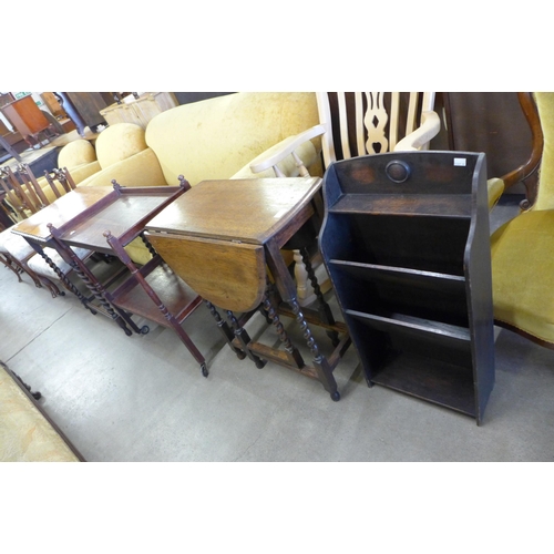 144 - An oak barleytwist gateleg table and occasional table, an oak trolley and a newspaper stand